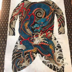 a drawing of a blue dragon with red accents on it's chest and arms