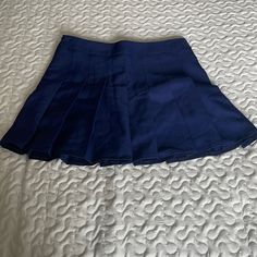 Color: Navy Blue Size: Says Xl But Fits More Like A Medium Never Worn Before Blue School Uniform Pleated Skirt, Preppy Fitted Short Length Skort, Fitted Blue Mini Skirt With Short Inseam, Navy Casual Tennis Skirt, Navy Casual Fitted Tennis Skirt, Casual Fitted Navy Tennis Skirt, Preppy Fitted Short Skort, Blue Mini Length Skirt For School, Blue Stretch Skirt With Short Inseam