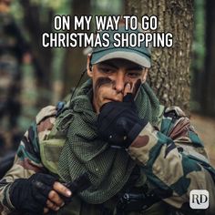 a man in camouflage holding his hand to his face with the caption on my way to go christmas shopping