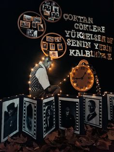 there is a display with pictures and lights on the wall in front of it that has an image of a man reading