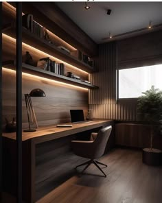 a desk with a laptop on top of it in front of a book shelf filled with books