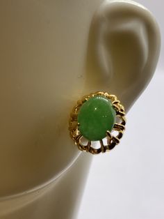 "These are lovely Green Jade Stud Earrings  Approximately 1/2 inch See our full collection of Vintage Jade: https://www.etsy.com/shop/EastVillageBangles?section_id=38654118 Jade, a birthstone of August, is often the gemstone associated with the twelfth wedding anniversary.  Jade comes in Nephrite and Jadeite varieties, each a crystallized form of silica. Jade draws its name from the Latin ilia, meaning 'flanks, kidney area' giving rise to the informal \"loinstone\".  Jade is known as a symbol of good luck, longevity, and wisdom promoting self acceptance and love. Jade brings a restoring energy balancing Heart chakra.   Jade is a relatively hard stone rating 6.5 on the Mohs scale.  Jade can be cleaned with mild soap in warm water, and a soft toothbrush or cloth.  Avoid harsh cleansers, blea Classic Green Clip-on Earrings As Gift, Collectible Gold Jade Jewelry, Gold Jade Earrings With Natural Stones, Traditional Pierced Jade Earrings, Traditional Handmade Jade Earrings, Luxury Jade Gemstone Earrings, Fancy Blouse, Jade Earrings, Soft Toothbrush