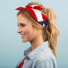 a woman wearing a patriotic headband with an american flag design on it's side