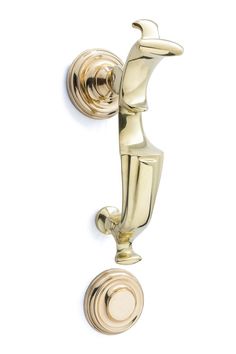 an old fashioned brass door handle on a white wall with a round knob in the middle