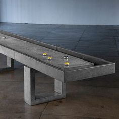 The James de Wulf Shuffleboard table is a lively addition to any game room. The 160" table is constructed of concrete reinforced with carbon fiber. The smooth glide of the pucks across the finished concrete, paired with the table's brutal design, creates a unique experience for the player.Suitable indoors or outdoors in any climate.Available concrete colors:• Natural tone• Light grey• Dark grey• BlackJames de Wulf has been widely recognized for his original and innovative work with concrete design and rapidly became known for his ability to fuse advanced concrete technology with aesthetic, modern, and natural concrete forms to constitute functional art.6-8 week fabrication Shuffle Board Table, Brutal Design, Shuffle Board, Board Table, Shuffleboard Table, Basement Makeover, Concrete Forms, Concrete Color, Concrete Design