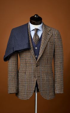 This robust sport coat uses a classic brown and blue gun club check Harris Tweed for timeless style that feels tough as nails. Part of our Emerald Label “Sartorial” collection, the jacket features our signature Neo Cut, with unpadded shoulders, a 3-roll-2 button closure, and a hand-sewn Milanese lapel buttonhole. Wear it with a turtleneck sweater and flannel trousers on a chilly day. Tough As Nails, Brown And Blue, Harris Tweed, Timeless Fashion