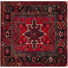 a red rug with an intricate design on the middle and bottom, in different colors