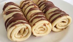 chocolate and cream rolled up on a white plate