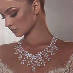 Our luxury clear Swarovski crystal necklace will make you feel like a queen on your wedding day, prom or formal dinner. Pair it with one of our matching pairs of CZ earrings for the most exquisite one-of-a-kind bridal or gala look.This beautiful hand wired crystal statement necklace matches classic charm with modern beauty. Matching earrings are available and sold separately.DIMENSIONS: Necklace is about: 14.2"L + 8.0"L ExtensionEarrings are about: 3.3"L x 2.5"WCLOSURE: Lobster claw closureMATER Rhinestone Bridal Jewelry, Mermaid Long Bridesmaid Dresses, Pearl Bridesmaid Jewelry, Beach Jewelry Boho, Bridal Jewelry Necklace, Crystal Statement Necklace, Collar Chain, Swarovski Crystal Necklace, Bridesmaid Dresses Online