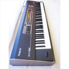 an electronic keyboard sitting on top of a table