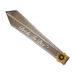 a tie with a sunflower on it and the words bride to be written in white