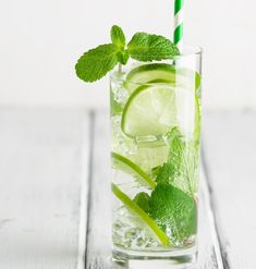 a mojito drink with lime and mint