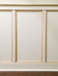 an empty room with white walls and wood flooring is pictured in this image from the front