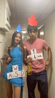 two people dressed up in costumes standing next to each other