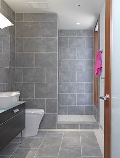 an image of a bathroom with gray tile