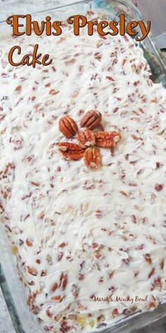 a close up of a cake in a pan with pecans on top and the words elvis's presley cake above it