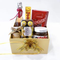 a gift box filled with assorted chocolates and confection items for someone's special occasion