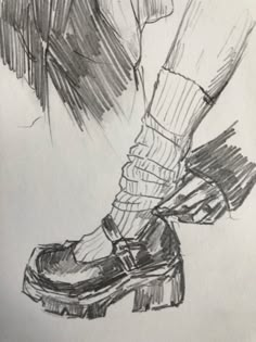 a drawing of a person's feet with socks and shoes on top of them