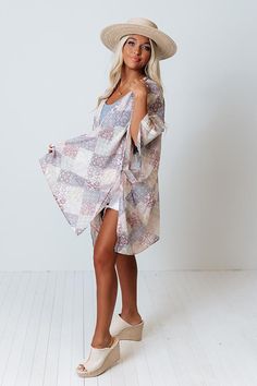 You can never be too chic...especially when you layer up in style with this unique sky blue colored overlay! It features ultra lightweight breezy material patterned with a variety of intricate patchwork patterns, oversized 3/4-length sleeves, and a draped open front silhouette that cascades into a straight mid-thigh length hemline with accent side slits! Spring Beach Kimono With Patchwork, Breezy Long Sleeve Spring Cover-up, Spring Breezy Cover-up With Long Sleeves, Summer Layering Long Sleeve Kimono, Summer Long Sleeve Kimono For Layering, Long Sleeve Summer Kimono For Layering, Summer Kimono For Layering, Long Sleeve Summer Layering Cover-up, Flowy Long Sleeve Cover-up For Day Out