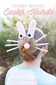 a girl with bunny ears on her head and hair sticks in the shape of rabbits