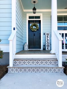 a front porch with stairs painted black and white