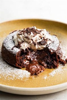 a chocolate dessert on a plate with powdered sugar