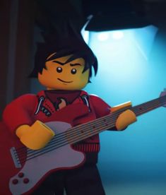 a lego man holding a guitar and wearing a red shirt