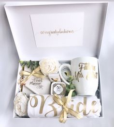 a white box with coffee and flowers in it