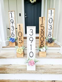 wooden numbers and flowers are on the front steps