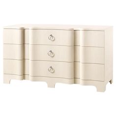 a white dresser with four drawers and two handles