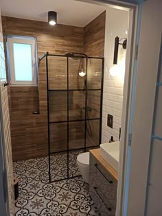 a bathroom with a shower, toilet and sink