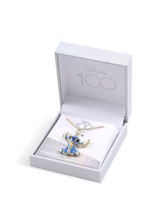 This Official Disney sterling silver Lilo and Stitch pendant necklace is the perfect gift for any Disney fan! Featuring a sterling silver double chain necklace with a blue and gold pendant of Stitch himself. Supplied in official Disney packaging. Stitch Necklace, Double Chain Necklace, Gold And Blue, London Print, Wedge Ankle Boots, Disney Fan, Giraffe Print, Double Chain, Gold Lace