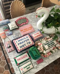 a table topped with lots of different types of cakes and decorations on top of it