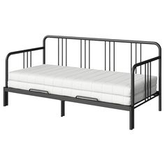 a black metal daybed with white mattresses on the bottom and side rails, against a white background