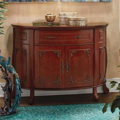 a wooden cabinet with two doors and drawers