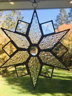 a stained glass star hanging from the ceiling