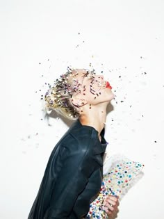 a woman with sprinkles all over her face