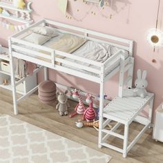 a white bunk bed sitting on top of a wooden floor next to a pink wall