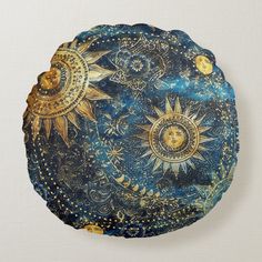 a decorative plate with sun and moon designs on it