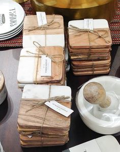 a table topped with lots of brown paper wrapped in twine