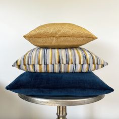 three pillows stacked on top of each other