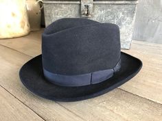 "Black Felt Homburg Fedora Hat 1910s, Paris by Tirard Freres Beautiful and genuine period mens hat. Gentleman's black felted Homburg fedora hat, black grosgrain silk ribbon band. Inner leather band has the gilded company logo and the silk inner lining has blue printed detailing with a heraldic crest for \"Tirard Freres\", \"Paris\". The \"Chapellerie Tirard\" worked between 1878 and 1956. Measures; approx. 21.75\" interior circumference, 7.75\" front to back and 6.25\" side to side. Hat is Not s Vintage Wool Hat Bands For Formal Occasions, Vintage Formal Hat Bands, Vintage Black Hat Bands For Winter, Formal Winter Flat Cap Felt Hat, Winter Formal Felt Flat Cap, Vintage Formal Hat Bands In Solid Color, Formal Winter Felt Flat Cap, Classic Formal Flat Cap Felt Hat, Fitted Formal Flat Cap Felt Hat