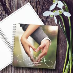 a couple holding hands with the words forever written on them next to two spiral notebooks