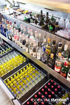 an assortment of alcohol bottles on display in a store