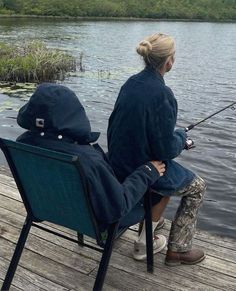 a woman sitting on a chair while fishing