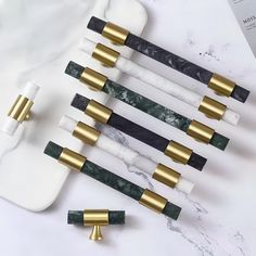 marble and brass handles on white marble counter top