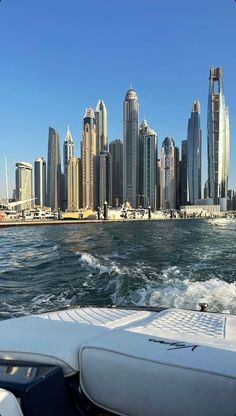 the city skyline as seen from a boat in the water