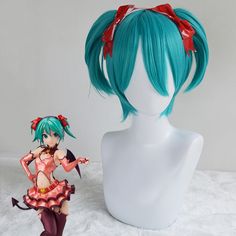 an anime wig with blue hair and red bows on it next to a white mannequin