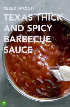 there is a sauce in a pot with the words texas thick and spicy barbecue sauce