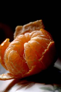 an orange is peeled and sitting on a table